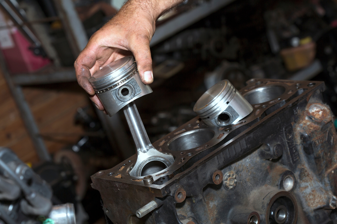 An engine piston in hand