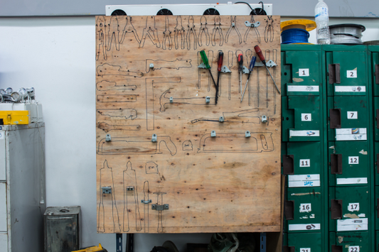 Organised tools on a peg board 